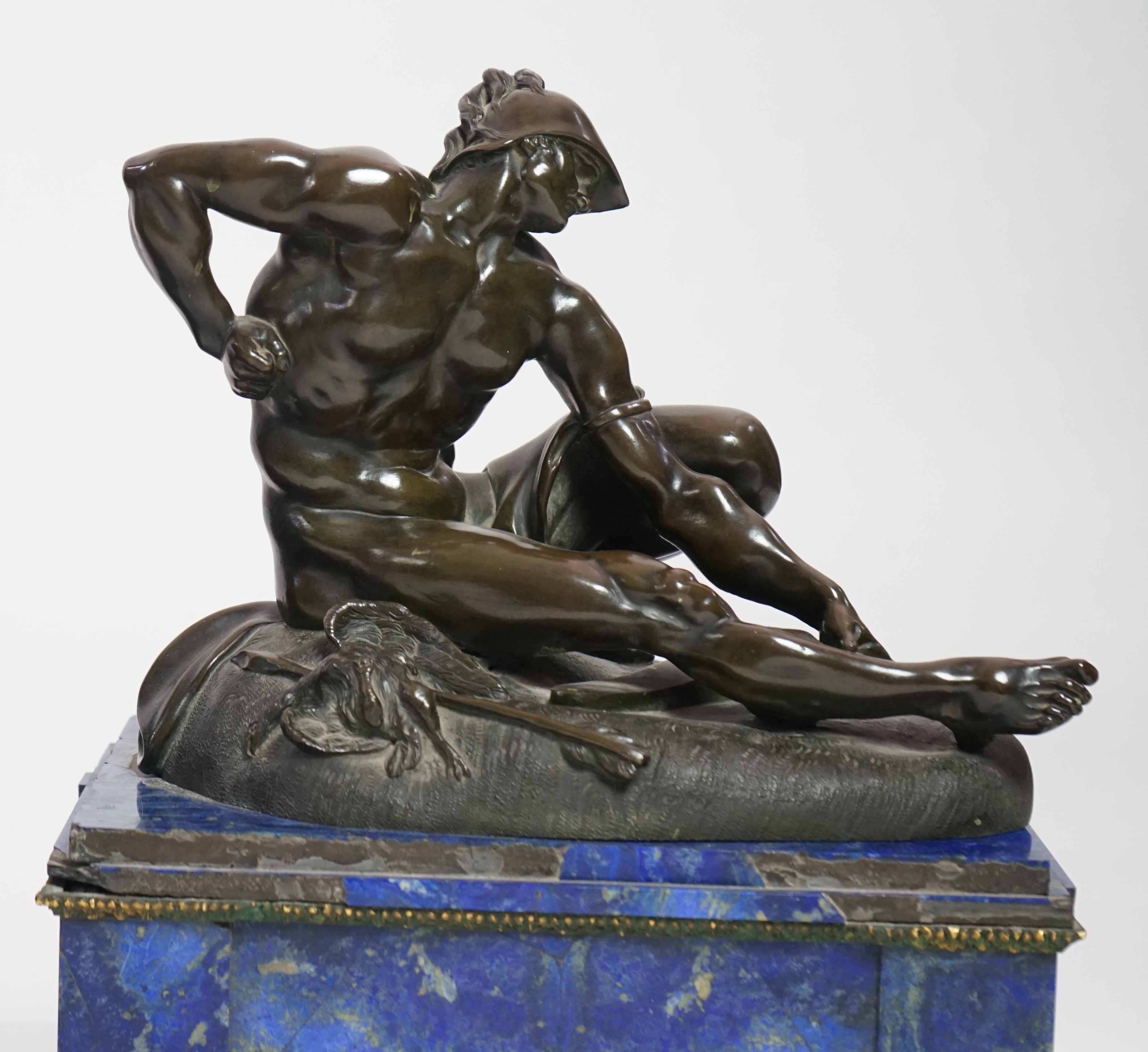 After the antique, a pair of late 18th/early 19th century Grand Tour souvenir bronze figures of seated warriors
